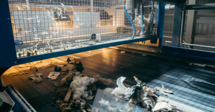 A near infrared (NIR) optical sorter removes impurities from Solid Recovered Fuel.